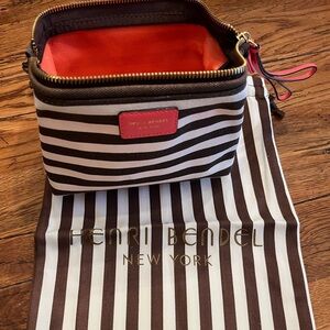 Henri Bendel hinged pouch with coral pink accents